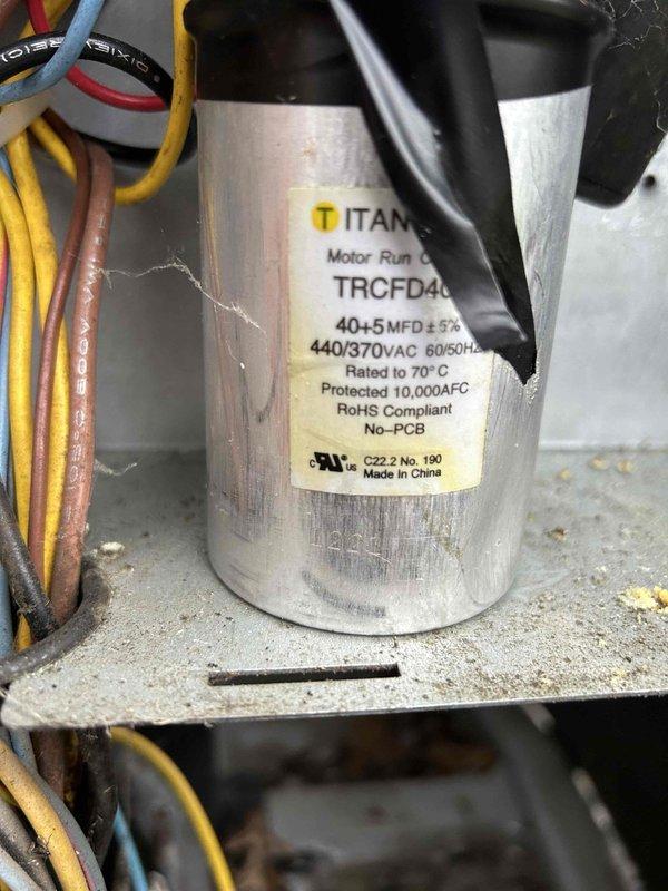 Performed routine maintenance on dual AC/gas furnace systems in unit #213. Inspected burner flame pattern confirming proper combustion in gas furnace. Examined and verified specifications of TITAN TRCFD40 motor run capacitor (40+5 MFD, 440/370VAC) in good working condition. Filter was provided by owner for both units - one located in mother-in-law suite utility room and second unit in crawl space.