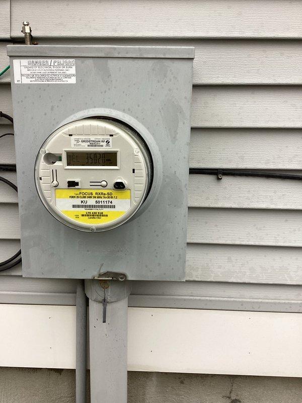 Conducted site assessment for residential generator installation. Inspected electrical service entrance including FOCUS RXR-SD utility meter and evaluated property layout for optimal generator placement. Documented existing utility connections and service capacity to determine appropriate generator specifications and installation requirements.
