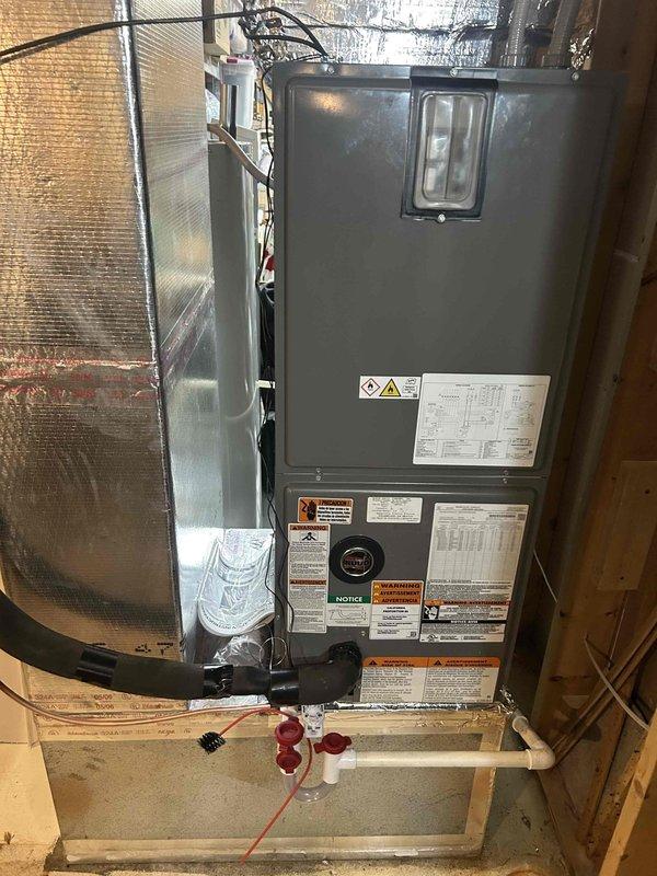 Successfully installed a complete RUUD HVAC system including a 14.3 SEER2 3-ton two-stage heat pump (RP14AY36AJ2NA), 3-ton air handler (RH2TY3617STANNJ), and 15KW heat kit (RXBH-1724A15J-B) with digital thermostat. Installation included standard components such as trap, SS2 coil drain safety water sensor, transition to existing ductwork, refrigerant line insulation, and electrical connections, with the system properly mounted and all connections verified for optimal performance.