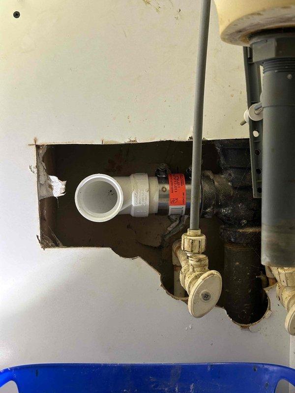 Responded to service call for a clogged right sink in upstairs dual bathroom sink. Inspected the PVC P-trap drain assembly and discovered blockage. Accessed the cleanout point, removed obstruction from the drain line, and verified proper drainage function in both sinks.