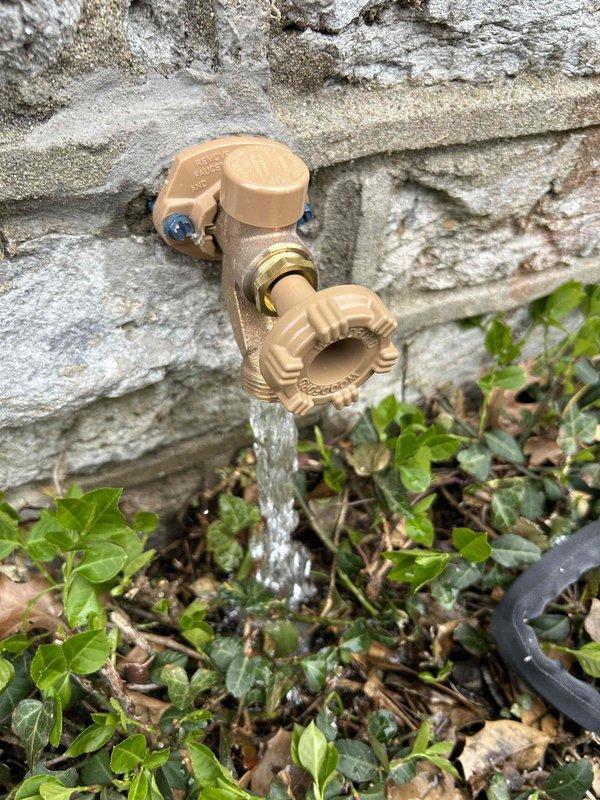 Replaced faulty outdoor spigot on stone exterior wall, requiring access to basement crawl space to disconnect and replace copper supply line connection. New fixture was installed with proper sealing against masonry surface and tested to ensure proper water flow and no leakage at connection points.