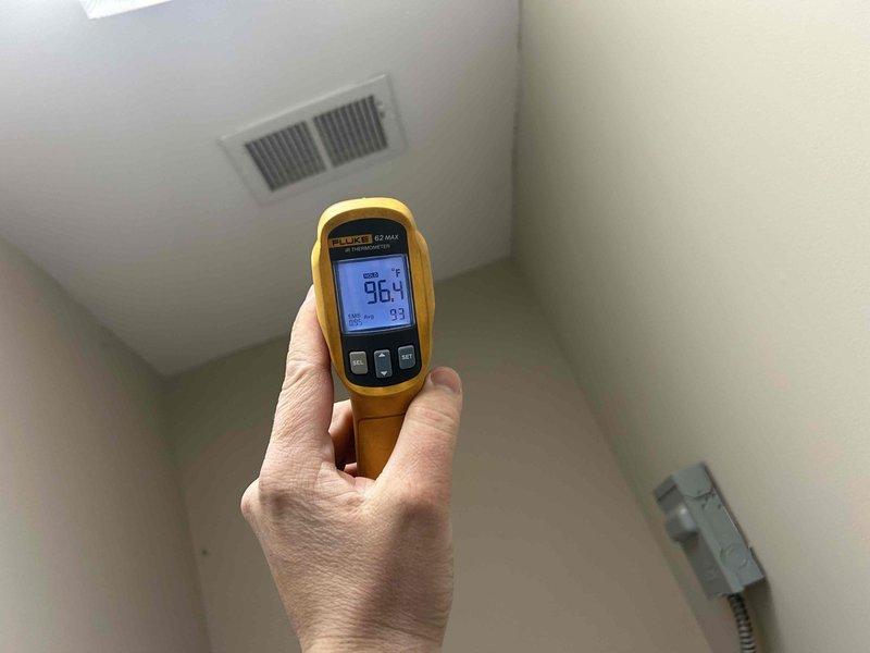 Performed Care Plan tune-up service on a single HVAC system of undetermined age. Conducted temperature measurements at supply registers using infrared thermometer, confirming proper operation with readings of 96.4°F. Inspected blower wheel assembly which appeared functional with normal dust accumulation but no significant deterioration.