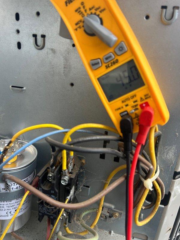 Performed annual tune-up on attic-mounted AC/gas furnace system per Care Plan requirements. Conducted electrical diagnostic testing with multimeter, verifying proper voltage readings (45.0V and 418V) at critical components. Inspected capacitor and wiring connections, confirming system is operating within manufacturer specifications. Customer-supplied 16x25x1 filter was installed.