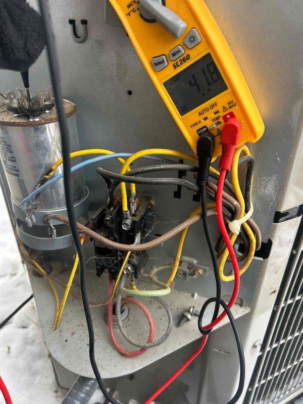 Performed annual tune-up on attic-mounted AC/gas furnace system per Care Plan requirements. Conducted electrical diagnostic testing with multimeter, verifying proper voltage readings (45.0V and 418V) at critical components. Inspected capacitor and wiring connections, confirming system is operating within manufacturer specifications. Customer-supplied 16x25x1 filter was installed.