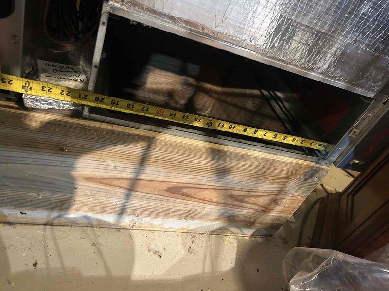 Performed diagnostic assessment on dual HVAC units per customer's high energy bill concerns. Inspection revealed significant dust accumulation on evaporator coils affecting system efficiency. Measured and documented ductwork dimensions (approximately 25") to evaluate proper airflow. Recommended standard cleaning of coils and filter replacement to improve system performance and reduce energy consumption, which should address the intermittent red indicator light issues.