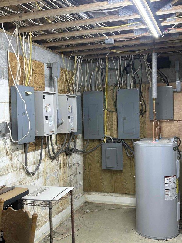 Performed diagnostic service on 45KW liquid-cooled Generac generator (Serial #4690426). Multiple fault codes were detected during inspection. Advised against attempting to start the unit due to numerous active error codes. Documented electrical panel configuration and generator integration with the building's electrical system.