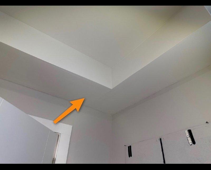 Conducted moisture inspection of interior wall junction following home inspection concerns. Moisture meter readings indicated significant water intrusion (80.9 with "WET" indication) in the ceiling-wall corner area. Documented evidence of potential plumbing leak requiring further investigation and repair to address inspector findings prior to property transfer.