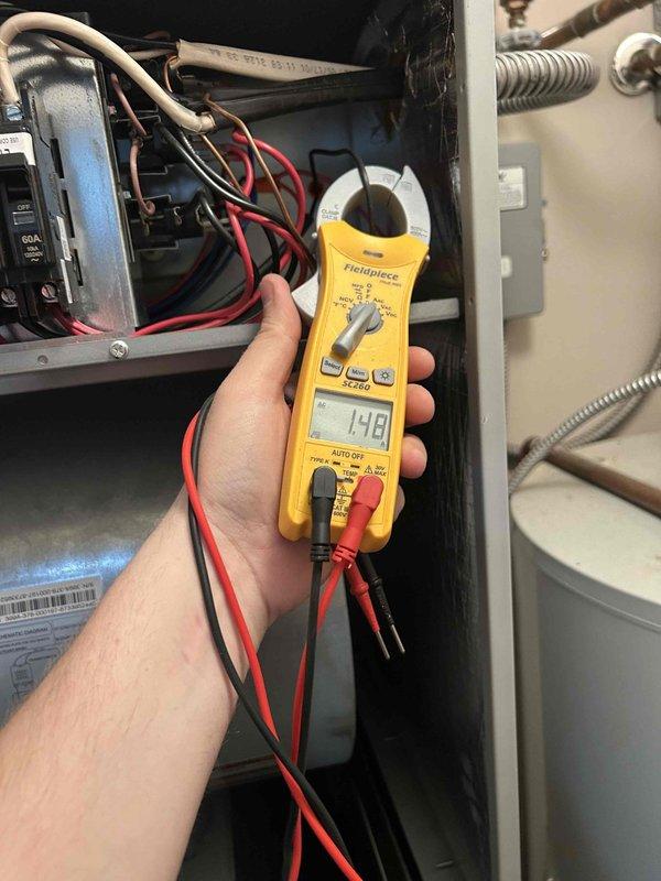 Performed Care Plan Tune Up on heat pump/air handler system installed in 2024. Conducted electrical diagnostics with clamp meter confirming 148V reading at control panel. Verified proper operation of Honeywell Home Pro Series smart thermostat (71° current/69° set point) and noted weak Wi-Fi signal (1 bar) with 32% battery level. Customer will provide 20x20x1 filters for future maintenance.