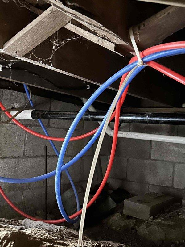 Conducted site assessment for 22KW generator installation with 200AMP service entrance transfer switch and SPD. Evaluated crawlspace/basement area for new gas piping requirements, noting existing PEX water lines and structural elements. Project preparation completed; awaiting final installation as collection was not required per instructions.