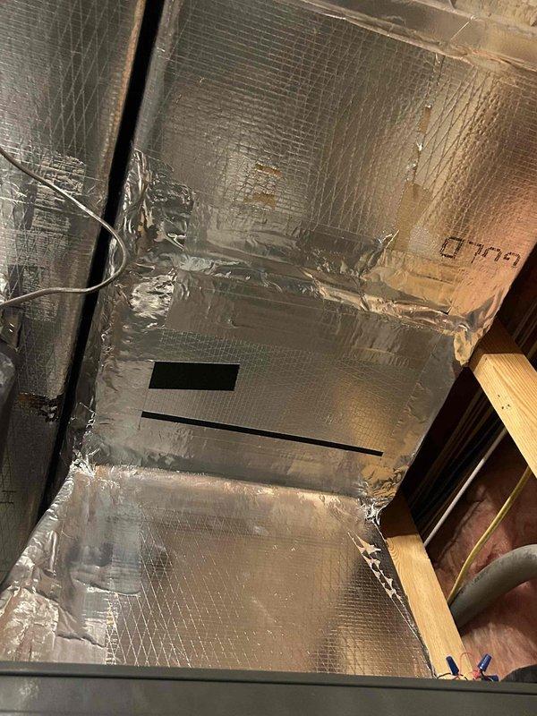 Responded to no-heat call for 6-year-old electric furnace system. Investigated burning smell and system non-response. Diagnostic testing with Fluke 302+ clamp meter revealed electrical fault in control panel (reading 023). Inspected ductwork and electrical connections, then repaired faulty wiring in junction box to restore system operation.