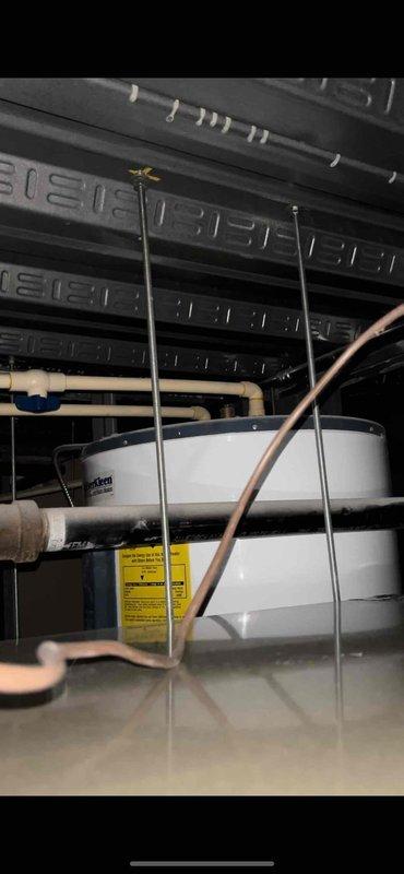 Conducted on-site assessment of 80-gallon Rheem water heater currently installed in elevated closet location. Customer requested replacement options for existing tank-style unit and additional quote for relocating installation to improve accessibility. Visual inspection revealed standard plumbing connections with copper and PVC piping. Customer requires appointment after 3:00 PM with advance notification.