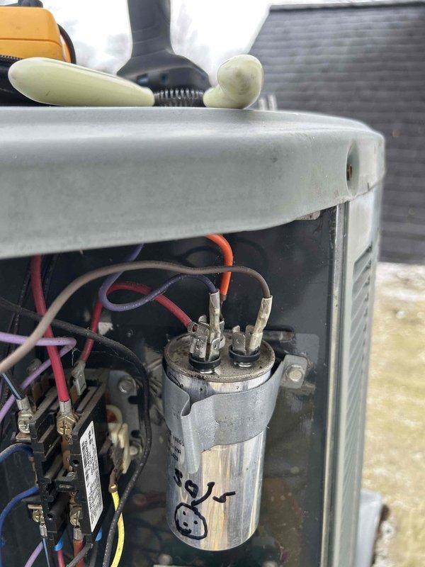 Performed scheduled Care Plan Tune Up on AC/GF and HP/AH system with customer-supplied filter. Inspection revealed significant copper corrosion and rust formation on evaporator coils and heat exchanger components. Capacitor connections were checked and found secure with proper wire terminal attachments, though unit shows signs of age-related wear requiring monitoring.