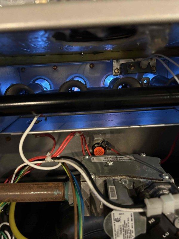 Performed Care Plan Tune Up on 2.5 HVAC systems including heat pump, air handler, AC, two gas furnaces (one located in attic), and one humidifier. Inspected gas furnace operation, verified proper flame characteristics and electrical connections. Temperature readings confirmed proper system operation at 41.7°F supply air, indicating normal cooling performance.