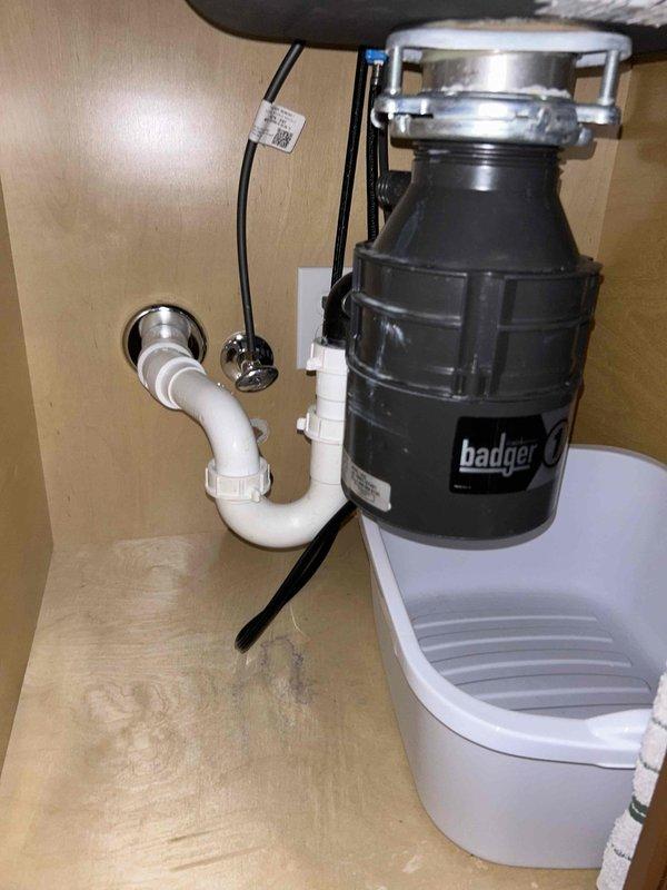 # Service Summary

Completed comprehensive 60-point inspection and tankless water heater maintenance service, including system flush and performance evaluation.

# Work Performed

Performed complete tankless water heater maintenance protocol, including descaling flush to remove mineral buildup and ensure optimal heat exchanger efficiency. Conducted thorough 60-point inspection of all plumbing systems and components throughout the property.

Inspected kitchen plumbing infrastructure, including garbage disposal unit and drainage system. Verified proper installation and operation of Badger brand disposal unit with secure mounting ring and electrical connections. Examined P-trap configuration and PVC drainage piping for proper slope, secure connections, and absence of leaks. Confirmed appropriate venting and drain functionality.

Evaluated HVAC system components as part of comprehensive inspection. Assessed refrigerant lines, service connections, and system pressures using manifold gauges.