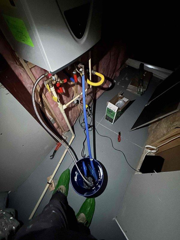 # Service Summary

Completed comprehensive 60-point inspection and tankless water heater maintenance service, including system flush and performance evaluation.

# Work Performed

Performed complete tankless water heater maintenance protocol, including descaling flush to remove mineral buildup and ensure optimal heat exchanger efficiency. Conducted thorough 60-point inspection of all plumbing systems and components throughout the property.

Inspected kitchen plumbing infrastructure, including garbage disposal unit and drainage system. Verified proper installation and operation of Badger brand disposal unit with secure mounting ring and electrical connections. Examined P-trap configuration and PVC drainage piping for proper slope, secure connections, and absence of leaks. Confirmed appropriate venting and drain functionality.

Evaluated HVAC system components as part of comprehensive inspection. Assessed refrigerant lines, service connections, and system pressures using manifold gauges.