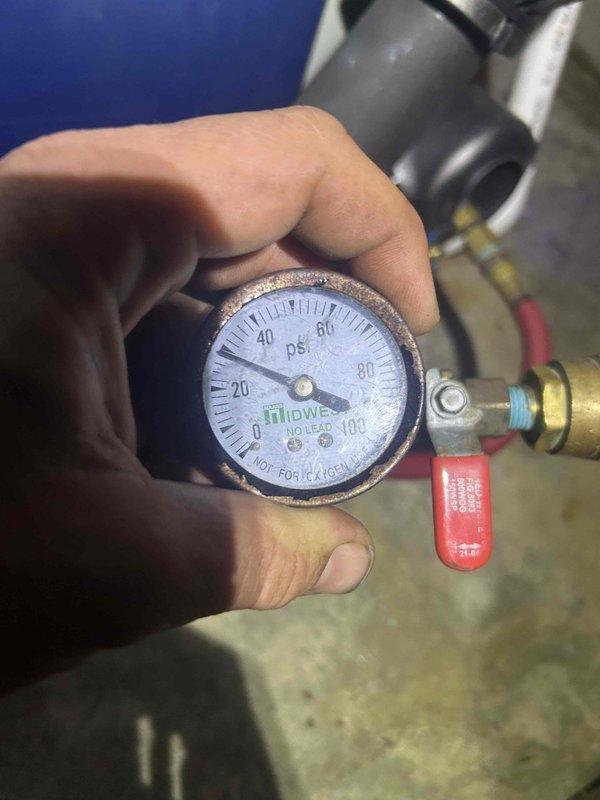 # Service Summary

Performed follow-up site visit to assess geothermal loop pressures and verify system integrity. Conducted pressure testing using calibrated gauge to measure PSI levels on the ground loop side of the geothermal heat pump system. Inspected loop pressure readings and mechanical components to rule out potential refrigerant or water loop leaks. Visual inspection of system controls and zone valves completed. Documentation captured via photographs showing pressure gauge readings and control mechanisms. System monitoring confirmed stable pressure levels with no evidence of active leaks detected at time of inspection. Recommended continued monitoring of loop pressures to ensure long-term system performance and efficiency.