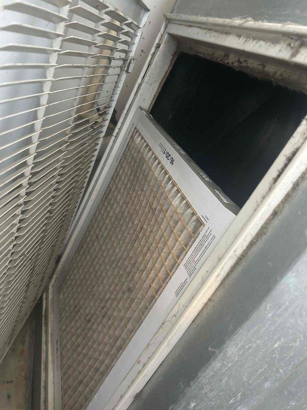 # Service Report

Responded to no cooling complaint on 2-year-old residential AC system. Upon inspection, discovered severely corroded electrical terminal block and connections at air handler, indicating significant moisture intrusion despite unit's young age. Corrosion had compromised electrical continuity, preventing system operation. Heat exchanger and evaporator coil showed heavy dust accumulation, restricting airflow and suggesting inadequate filtration. Documented extensive corrosion damage with photos showing rust-covered terminal assembly, deteriorated copper line connections, and compromised metal housing. Recommended immediate replacement of corroded electrical components and thorough system evaluation to identify moisture source before restoration of service.