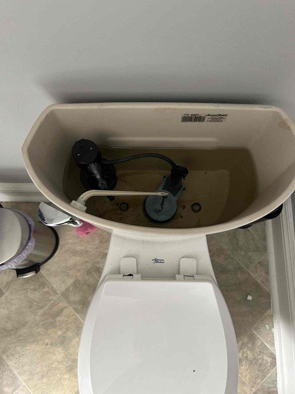 # Plumbing Service Report: Water Leak Investigation

## Service Summary
Responded to bathroom flooding complaint in 106-year-old residence. Conducted thorough inspection of toilet assembly and surrounding plumbing fixtures to identify source of water leak.

## Work Performed

Upon arrival, performed visual inspection of bathroom to assess flooding conditions and locate water source. Examined toilet assembly as primary suspect given proximity to reported flooding area. 

Removed toilet tank lid to inspect internal flush mechanism components including fill valve, flush valve assembly, and flapper mechanism. Verified water level in tank was within normal operating parameters. Inspected tank-to-bowl connection for signs of leakage, corrosion, or deterioration common in older installations.

Examined toilet bowl for cracks, hairline fractures, or porcelain damage that could allow water seepage onto bathroom floor. Checked wax ring seal integrity at toilet base connection to drain flange. In