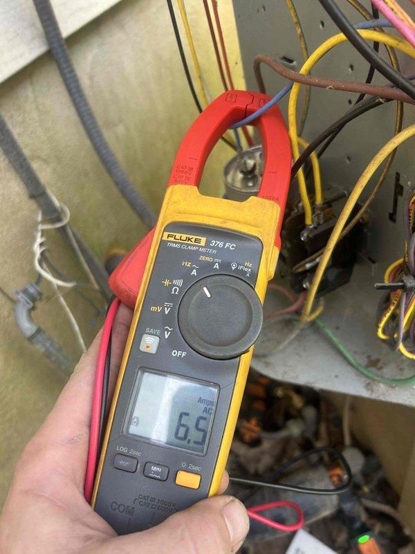 Completed comprehensive Care Plan tune-up on heat pump and air handler system installed in 2016. Performed electrical diagnostics using clamp meter, measuring amperage draws on compressor (65 amps) and blower motor (0.9 amps) to verify proper operation within manufacturer specifications. Inspected all electrical connections, contactor, capacitor, and wiring at both indoor and outdoor units, confirming system operating safely and efficiently.