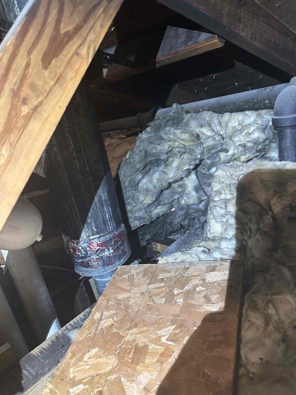 Responded to service call for disconnected HVAC exhaust pipe in attic space. Upon inspection, found flexible ductwork had separated from rigid duct connection at attic floor level. Accessed tight crawl space, repositioned and reconnected ductwork, and secured all joints to ensure proper ventilation flow. Verified system operation and confirmed exhaust routing was properly sealed and supported.