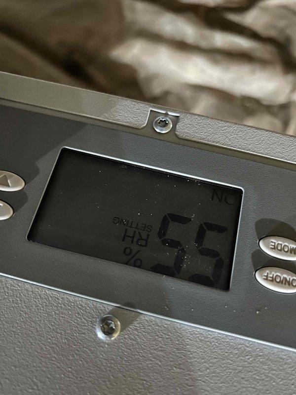 Installed Aprilaire E080 whole-house dehumidifier system in crawlspace as a stand-alone, non-ducted unit with 80-pint daily moisture removal capacity. Unit was mounted on concrete blocks for proper elevation and clearance, with built-in digital control panel configured for automatic humidity sensing. System includes condensate drainage line routed to appropriate discharge point to prevent moisture accumulation and protect against mold, wood rot, and structural damage.