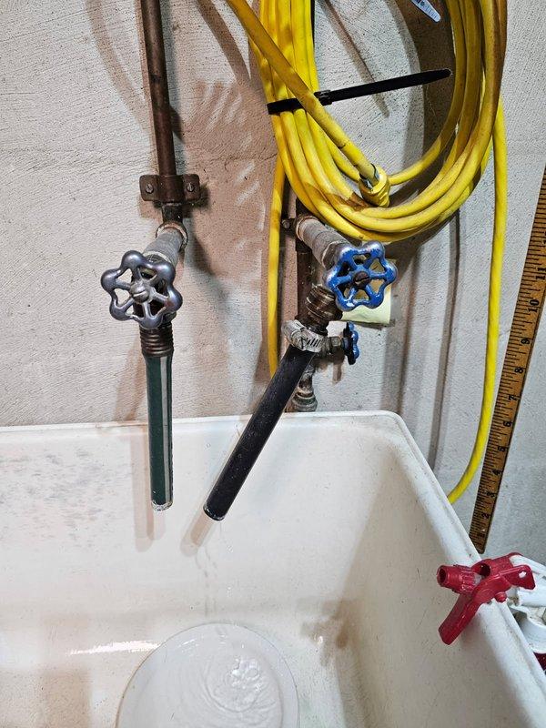 Responded to urgent call for garage utility sink faucet that was leaking and could not be shut off. Upon arrival, inspected wall-mounted faucet assembly with wheel-style valve handles serving utility sink. Diagnosed failed valve stem washer causing continuous water flow and inability to achieve complete shutoff. Disassembled valve assembly, replaced worn compression washer and valve seat, and reassembled fittings. Tested both hot and cold water supply lines for proper shutoff function and verified no leaks present. Restored full operational control of faucet valves.