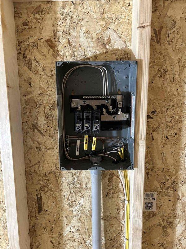 Completed electrical installation in commercial construction space, including installation of 100-amp main electrical panel with three circuit breakers and proper grounding. Installed four duplex receptacles, two GFCI-protected receptacles for wet location safety, and one weatherproof exterior receptacle. Wired single-pole switch for lighting control and installed two keyless light fixtures with bulbs. All wiring was run through appropriate conduit and secured to structural members per code requirements. Returned for final connections and coordinated with building inspector for successful electrical inspection and approval.