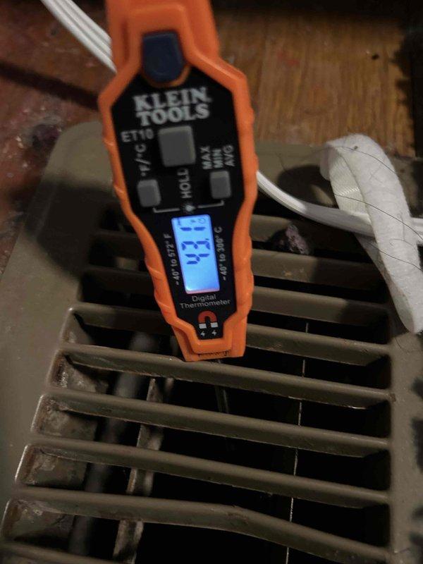 Completed preventative maintenance tune-up on air conditioning unit and gas furnace system located in closet. Performed comprehensive electrical diagnostics using digital multimeter, measuring capacitor performance at 363.0 microfarads to verify proper compressor operation. Tested supply air temperature at register, recording 33.4°F to confirm adequate cooling capacity and system efficiency. All electrical connections inspected and found secure, with capacitor terminals properly connected and functioning within specifications.