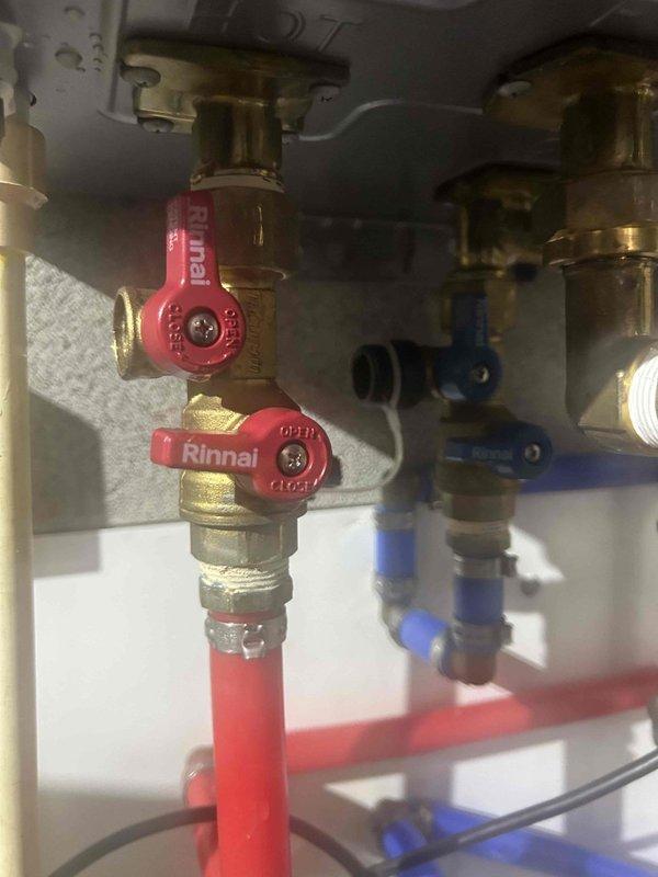 Completed comprehensive 60-point Bronze maintenance inspection on Rinnai tankless water heater system. Performed thorough tankless unit flush to remove mineral deposits and ensure optimal heat exchanger performance. Inspected all plumbing connections, isolation valves, and flexible water lines at the unit's inlet and outlet ports, confirming proper operation of shut-off valves and verifying integrity of brass fittings and braided stainless steel flex lines. All components found to be functioning correctly with no leaks detected.
