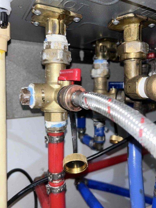 Completed comprehensive 60-point Bronze maintenance inspection on Rinnai tankless water heater system. Performed thorough tankless unit flush to remove mineral deposits and ensure optimal heat exchanger performance. Inspected all plumbing connections, isolation valves, and flexible water lines at the unit's inlet and outlet ports, confirming proper operation of shut-off valves and verifying integrity of brass fittings and braided stainless steel flex lines. All components found to be functioning correctly with no leaks detected.