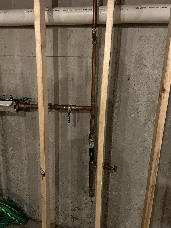 Completed water treatment estimate for whole home water purification system installation in residential property with unfinished basement. Assessed kitchen area with farmhouse sink and existing plumbing infrastructure to determine optimal reverse osmosis system placement at point of use. Evaluated basement mechanical room with exposed copper supply lines and PVC waste piping to plan water softener installation location and integration with existing plumbing system. Provided recommendations for new whole home water treatment equipment including softener unit for hard water mitigation and reverse osmosis system for drinking water purification.