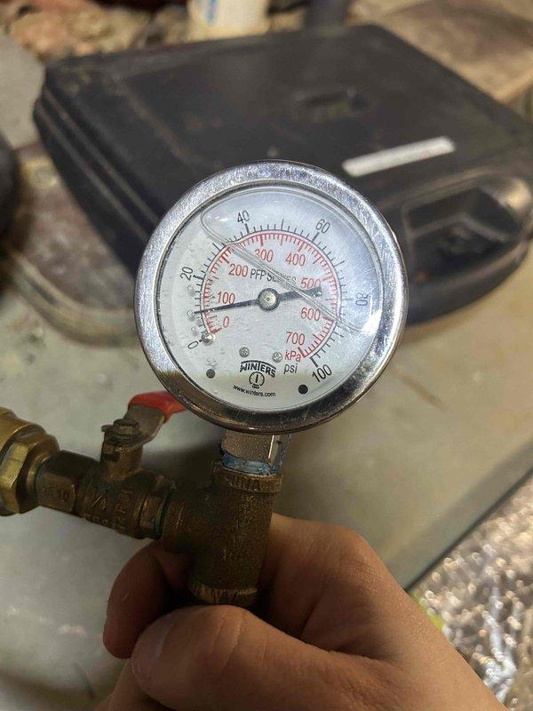 Completed routine maintenance inspection on Club Trio system consisting of one packaged geothermal unit, one split geothermal system, and one mini-split system located in basement, attic, and sunroom. Performed temperature diagnostics on evaporator coil, recording 42.4°F with proper condensation present, and verified system pressures at zero static conditions using calibration gauge, confirming all three units are operating within manufacturer specifications.