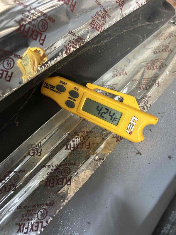 Completed routine maintenance inspection on Club Trio system consisting of one packaged geothermal unit, one split geothermal system, and one mini-split system located in basement, attic, and sunroom. Performed temperature diagnostics on evaporator coil, recording 42.4°F with proper condensation present, and verified system pressures at zero static conditions using calibration gauge, confirming all three units are operating within manufacturer specifications.