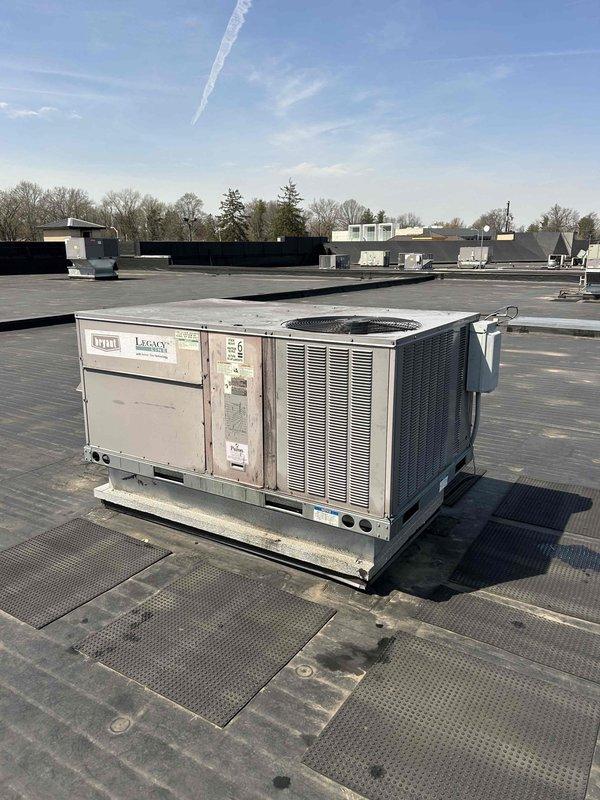 Completed warranty compressor replacement on commercial rooftop packaged HVAC unit over a three-day period. Recovered refrigerant, removed failed compressor, and performed comprehensive system flush from multiple access points to remove contaminants. Installed new compressor with new filter driers, conducted pressure test, and pulled overnight vacuum to ensure system integrity. Recharged system and monitored operation, then performed secondary refrigerant recovery, additional system flush, and filter drier replacement to ensure complete contamination removal. Completed final evacuation, recharged system to manufacturer specifications, and verified proper operation. Cleaned cabinet interior and collector box as part of warranty repair protocol.