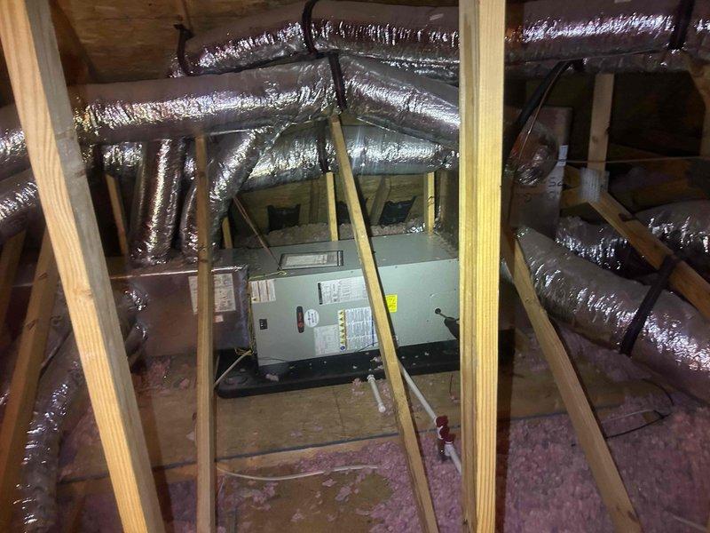# HVAC Service Call - No Cooling Condition

Responded to service call for 9-year-old residential air conditioning system with complete loss of cooling and heating functionality. Customer reported outdoor AC unit not operational.

## Diagnostic Procedures

Upon arrival, performed comprehensive system evaluation beginning with thermostat functionality check. Confirmed Trane thermostat displaying 77°F and verified proper power supply to control board. Tested thermostat communication with system components and confirmed display responding to input commands.

Proceeded to outdoor condensing unit inspection. Conducted visual assessment of compressor, condenser fan motor, and electrical connections. Verified power supply at disconnect and measured voltage at contactor. Tested capacitor values using multimeter to determine if dual-run capacitor within acceptable microfarad range.

Accessed attic-mounted air handler unit for indoor component evaluation. Inspected blower motor operation, evapora