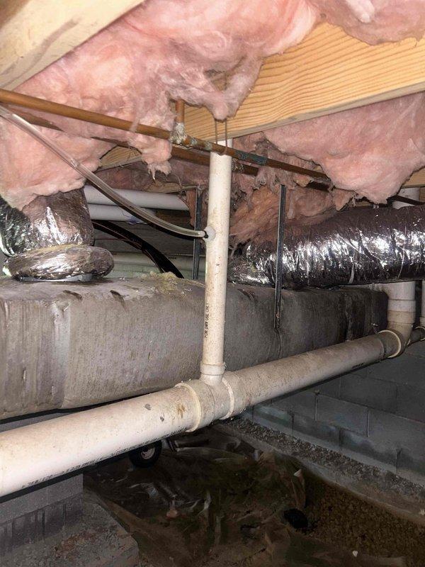Responded to install callback for condensate drain line code violation identified by city inspector. Reconfigured condensate line to meet code requirements by installing proper trap and venting system with open receptacle as specified. Ensured all connections were properly sealed and system was compliant with local plumbing codes for HVAC condensate drainage.