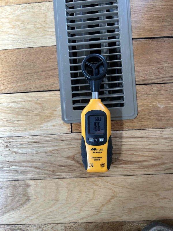 Returned to property to address accessibility concerns regarding downstairs zone ductwork. Located and accessed crawl space entry point through dedicated exterior access panel. Conducted thorough inspection of supply ducting for downstairs zone, which is partially buried in dirt floor with compromised insulation throughout crawl space. Documented conditions with photographs showing exposed floor joists, scattered fiberglass insulation, and flexible ductwork running through space. Measured airflow at downstairs registers and confirmed reduced performance due to dirty 20x24x1 filter and compromised duct conditions. Reviewed all findings and photographic documentation with property owner to provide complete system evaluation.