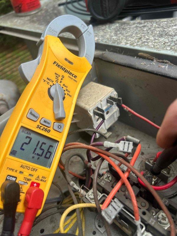 Performed comprehensive pre-sale inspection of residential HVAC system including both heating and cooling components. Accessed attic-mounted air handler unit and verified operational status of equipment. Inspected air filtration system, noting 16x20x1 filter installation. Examined condensate drain line configuration and PVC trap assembly for proper drainage. Evaluated electrical connections and performed amperage draw measurements using clamp meter on system components, recording readings to verify equipment operating within manufacturer specifications. Documented equipment condition through photographs for client records. Provided detailed findings and repair estimates to designated representative for pre-sale disclosure purposes.