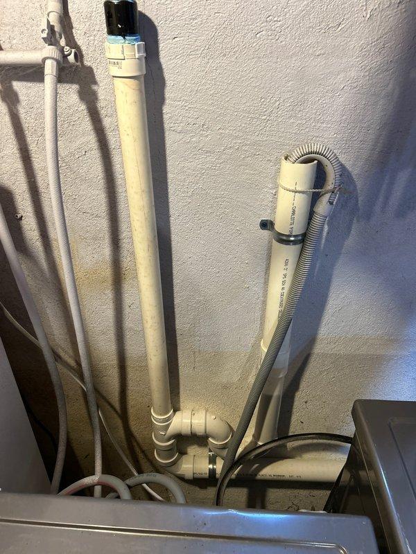 Completed installation of new hose bibb and sump pump system in basement area. Installed new drain line to accommodate washing machine and sink drainage requirements. All PVC piping and fittings were properly secured and routed through access points in wall structure, with appropriate venting and drainage slope maintained per code specifications. Exterior discharge piping for sump pump was mounted to exterior wall with proper support brackets and connected to drainage system using flexible corrugated tubing and PVC elbows. All plumbing connections were tested for proper flow and verified leak-free operation upon completion.