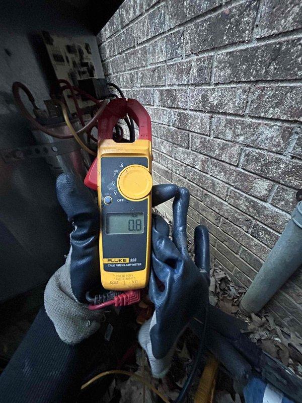 Completed comprehensive Care Plan tune-up on 10+ year old heat pump and air handler system located in garage. Performed diagnostic testing using Fluke clamp meter to verify electrical readings and system performance, conducted standard maintenance procedures including inspection of refrigerant lines and electrical connections, and documented equipment condition with photos for service records.