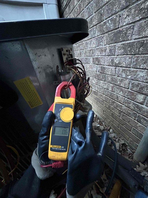 Completed comprehensive Care Plan tune-up on 10+ year old heat pump and air handler system located in garage. Performed diagnostic testing using Fluke clamp meter to verify electrical readings and system performance, conducted standard maintenance procedures including inspection of refrigerant lines and electrical connections, and documented equipment condition with photos for service records.