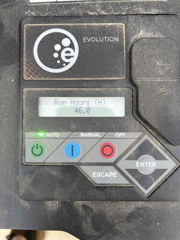 Performed routine electrical maintenance and inspection on Evolution-branded backup generator system integrated with Tesla Powerwall battery storage and utility metering infrastructure. Generator control panel displayed 46.0 run hours at time of service. Verified proper operation of AUTO/MANUAL/OFF selector switch, control interface functionality, and digital display readout accuracy. Documented current system configuration including Generac generator unit, dual utility meters, Tesla Powerwall units, and associated electrical conduit connections. All components operational and system ready for automatic transfer switch activation during utility outages.