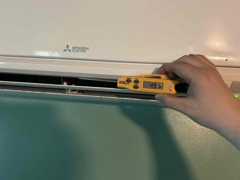 Completed preventive maintenance tune-up on two Mitsubishi Electric mini split systems previously installed in basement and attic locations. Performed comprehensive inspection of both indoor units, cleaned washable filters, verified proper airflow and temperature output with discharge air reading of 48°F, and confirmed all components operating within manufacturer specifications.