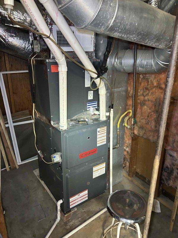 Completed comprehensive Care Plan tune-up on heat pump and air handler system located in third-floor knee wall area, with unit age exceeding 10 years. Performed diagnostic testing using digital multimeter, recording electrical readings at 456 on system components including gas valve assembly, copper refrigerant lines, and control wiring. Inspected Goodman furnace installation, PVC venting system, ductwork connections, and all mechanical components for proper operation and safety compliance.