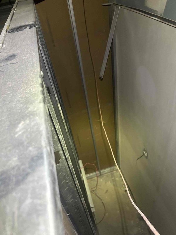 Responded to no cooling complaint on unit #4. Traced and located broken wire in ceiling chase between HVAC equipment panels. Two technicians accessed confined vertical space to diagnose and repair electrical fault, restoring cooling operation to unit.
