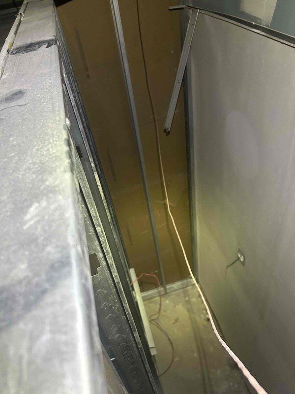 Responded to no cooling complaint on unit #4. Traced and located broken wire in ceiling chase between HVAC equipment panels. Two technicians accessed confined vertical space to diagnose and repair electrical fault, restoring cooling operation to unit.