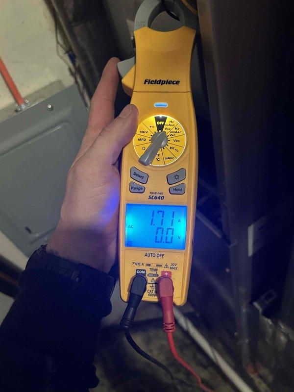 Completed comprehensive care plan tune-up on heat pump and air handler system. Performed electrical diagnostics using clamp meter, recording amperage draw of 17.1 amps, and inspected TITAN PRO TRCFD455 capacitor with all wire connections secure and functioning properly. System tested and operating within normal parameters with customer-provided filter in place.