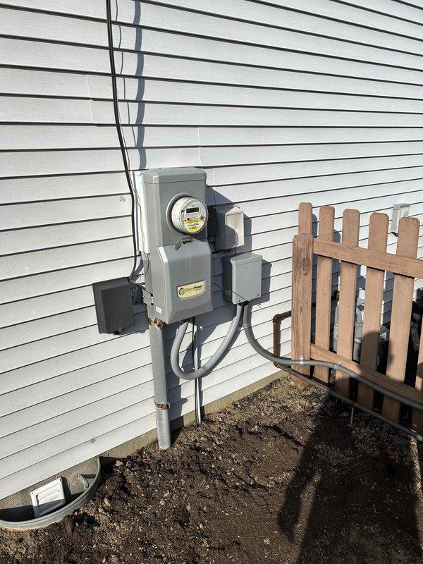 Completed scheduled maintenance on a Briggs and Stratton Fortress 12kW standby generator, serial number 4000159080. Performed comprehensive inspection of unit exterior, verified proper mounting on concrete pad, checked electrical connections at transfer switch and meter assembly, and documented equipment condition with photographic records per maintenance protocol.