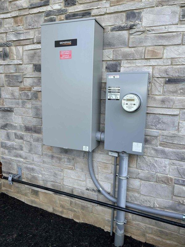 Completed first maintenance service on residential Generac backup generator system installed on exterior stone wall. Performed comprehensive inspection of generator unit, transfer switch, and associated electrical connections. Verified proper operation of all components, checked fluid levels, inspected air filtration system, and tested automatic transfer switch functionality. Generator system operating within manufacturer specifications with no issues identified during this initial maintenance visit.