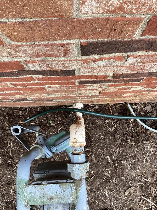 Conducted comprehensive electrical estimate for generator installation at residential property. Evaluated existing electrical infrastructure including main service panel, meter base, and exterior utility connections mounted on brick wall exterior. Assessed current electrical service capacity and determined optimal routing for generator connection conduit. Documented existing weathered outdoor plumbing fixtures and utility equipment locations to plan appropriate clearances and code-compliant placement for standby generator system. Photographed site conditions including brick wall mounting surfaces, existing conduit runs, and ground-level access points to develop accurate material list and labor requirements for complete automatic transfer switch installation and generator pad preparation.